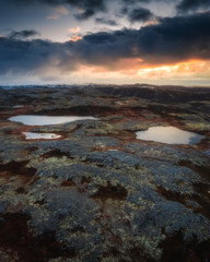 Tundra nature landscape in the sunset. Aerial view from drone. Kola Peninsula in the autumn. Murmansk Region in Northern Russia