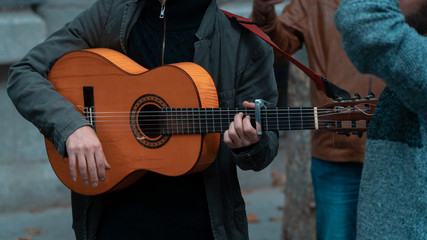 street musician playing the guitar