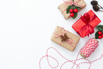 Christmas background, mock up with gift boxes wraped in craft paper, on white background. Winter...
