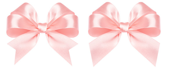 Gift bow made of pink silk ribbon isolated on white background