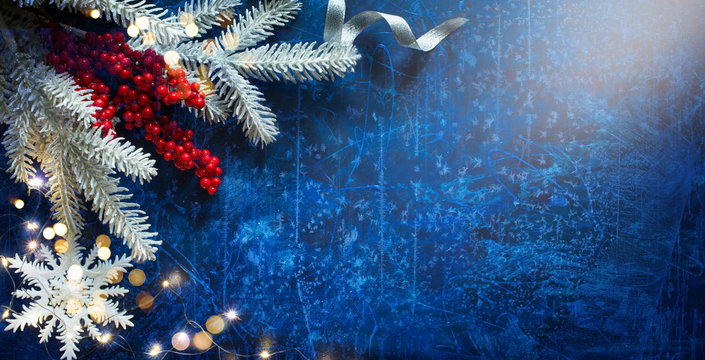 Snow Christmas Tree With Decoration Holiday Lights on Blue Background