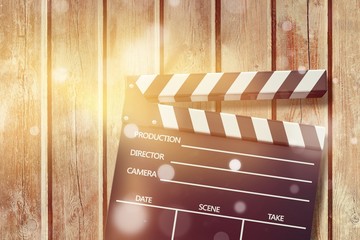Clap board on wooden background