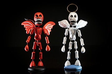 Devil and angel skeletons