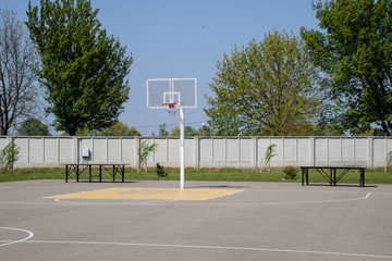 Basketball court and backboard with hoop. Yard basketball.