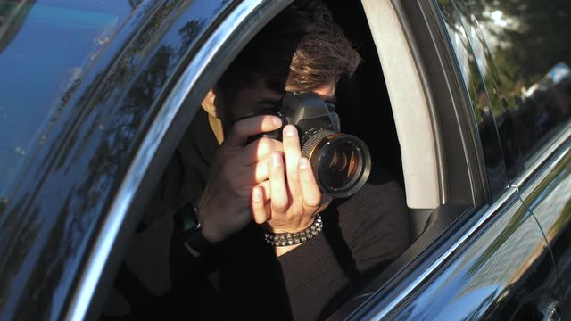 Man taking picture from the car