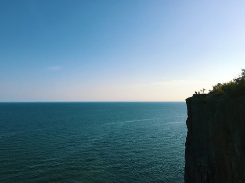Aerial view of sea by cliff
