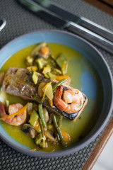 Pan Seared Salmon Steak with Prawns, Sauteed Vegetables and Spicy Citrus Sauce.