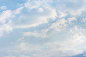 landscape sky with blue clouds and sunbeams at sunset. Background texture