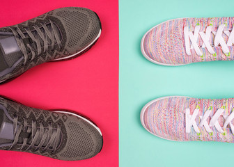 Sports fitness background. Flat lay sport shoes on blue and coral background. Concept healthy lifestyle. Sport equipment with copy space.