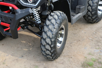 ATV front suspension with wheel.