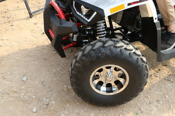 Fototapeta na wymiar ATV front suspension with wheel.