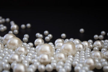 Bunch of multi size pearls on a background.Glamorous pearls milky-way.luxury lifestyle.Holiday decoration.Nice and shiny romantic morning.Love and success.