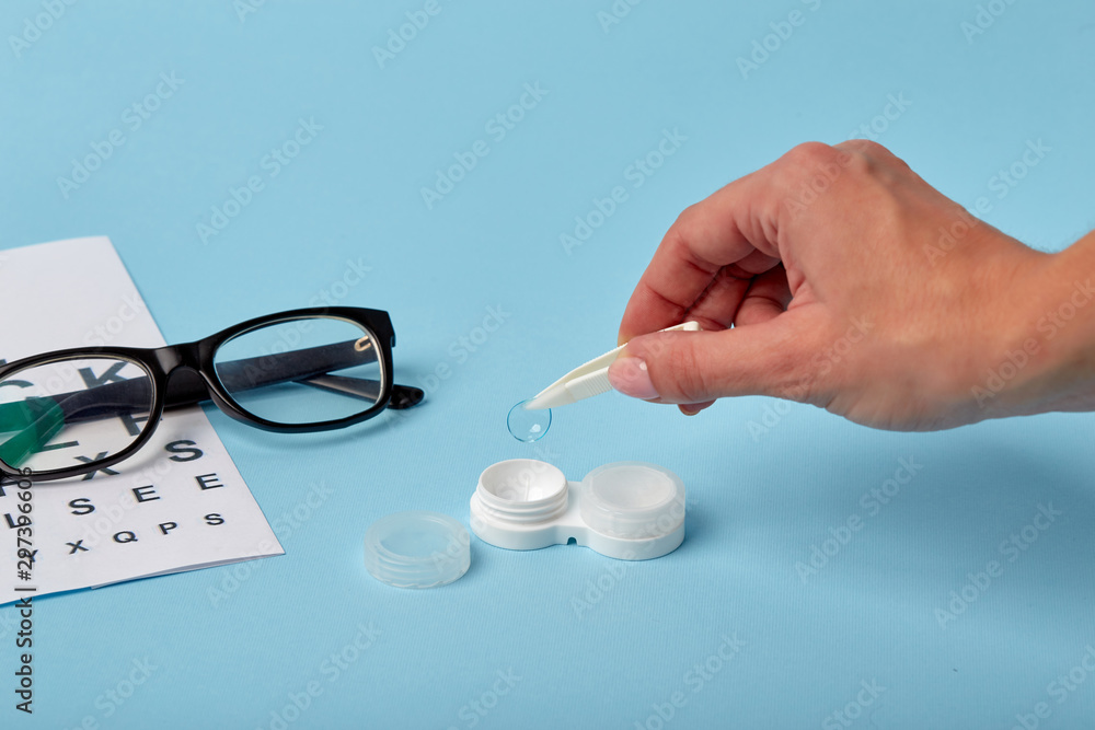 Sticker flat composition with contact lenses, table for eye examination. accessories for ophthalmologists. g