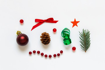 Christmas composition with green and red small objects