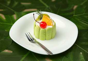 Close-up of a green round cake.