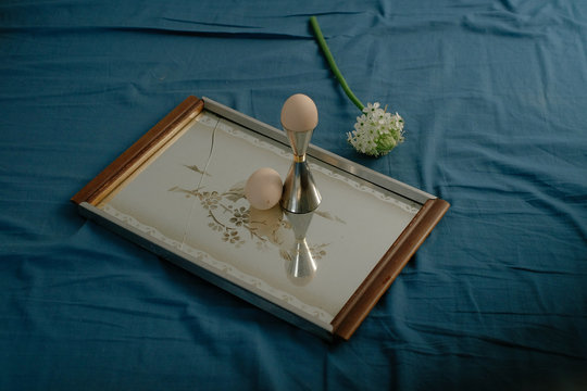 Eggs and flower placed on photo frame
