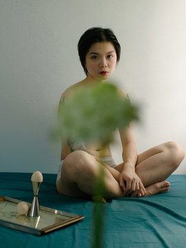 Woman sitting on bed