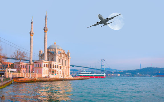 Airplane flying over Ortakoy Mosque with full moon - Istanbul, Turkey "Elements of this image furnished by NASA"