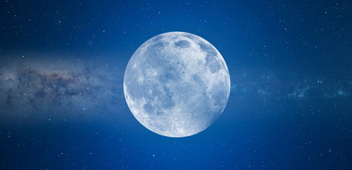Fototapeta Blue full moon against milky way galaxy 