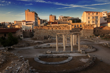 Part of the ensemble of the Hadrian Library in the rays of the setting sun, Athens, Greece. Ancient...