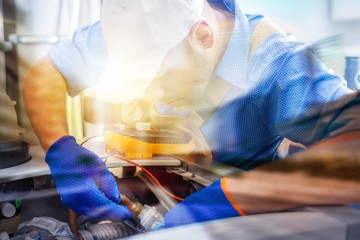 Handsome Professional plumber fixing pipes. Plumbing repair service.