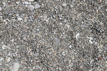 gray pebbles on the beach close up without people
