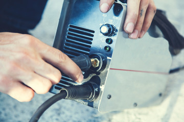 man hand welding machine