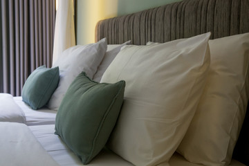 Soft cushions on the king-sized bed in the room
