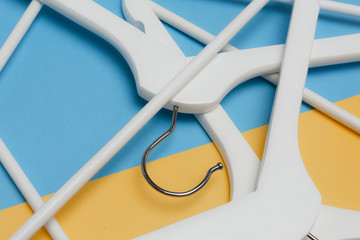 Hangers/ White wooden hangers / Store concept, sale, design, empty hanger.