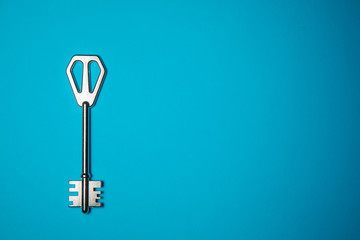 Key on blue background. Minimal creative style