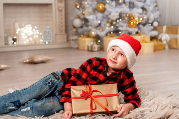 Fototapeta na wymiar baby boy in Santa hat looking wide smiling.