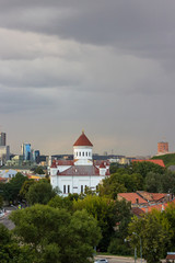 View on the Independent Republic of Uzupis and Cathedral of the Dormition of the Theotokos in Vilnius. It is main Orthodox Christian church of Lithuania. View from the hill near artillery bastion