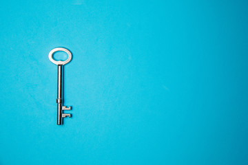 Key on blue background. Minimal creative style