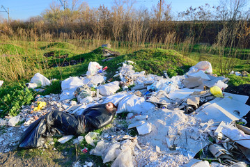 corpse of a young girl lies on a landfill