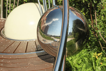 Reflections of the city in a metal ball