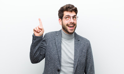 young manager man feeling like a happy and excited genius after realizing an idea, cheerfully...