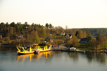 The yellow ship near sea coast