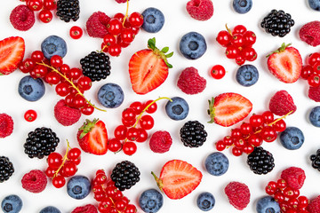 Strawberry, blueberry, blackberry, raspberry, currants on white background, top view. Berries texture. Pattern of fresh summer berries on white background. Creative food concept
