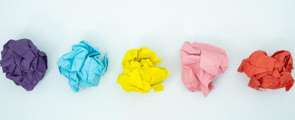 Crumpled  colorful paper is mauled on white blackground. ideas concept