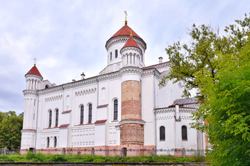Fototapeta na wymiar Lithuania, Vilnius - July 2019. Prechistensky Cathedral - Orthodox Cathedral in Vilnius. Old Town in Vilnius with beautiful white church. Landmark of Vilnius. Beautiful streets of the old city 