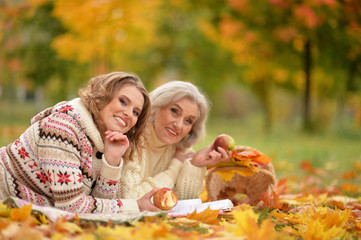 Close up portrait of senior woman with daughter resting