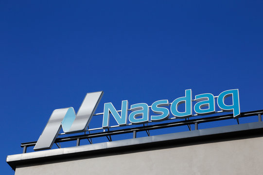 Stockholm, Sweden - July 4, 2016: Close up of the Nasdaq roof sign at the office in Stockholm at the Tullvaktsvagen street against the blue sky.