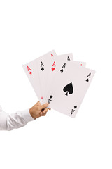 Male hand holding big aces playing cards