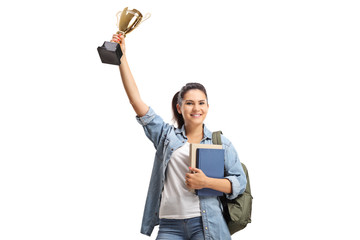 Happy female student holding a gold trophy