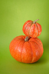 Orange pumpkins on green background, holiday decoration, Selective focus. Fall autumn concept. Halloween, Thanksgiving, Harvest