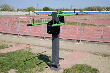 simulator for swinging the press by lifting the legs. Sports camp at the stadium.