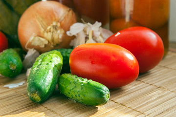 Fresh and Pickled Marinated vegetables. Homemade preserved food of Tomatoes and cucumbers.