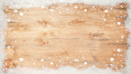 winter Background - Frame made of snow on wooden texture, top view with space for text