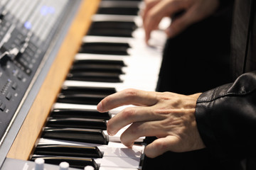 rock musician playing on a keyboard instrument