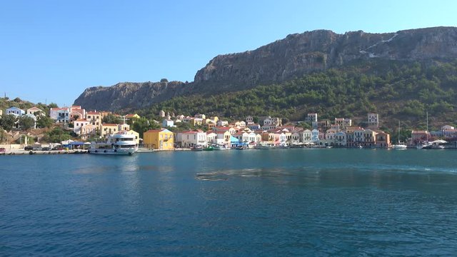 Kastellorizo island, Greece - 1st of October 2019: 4K Leaving beautiful Castellorizo bay